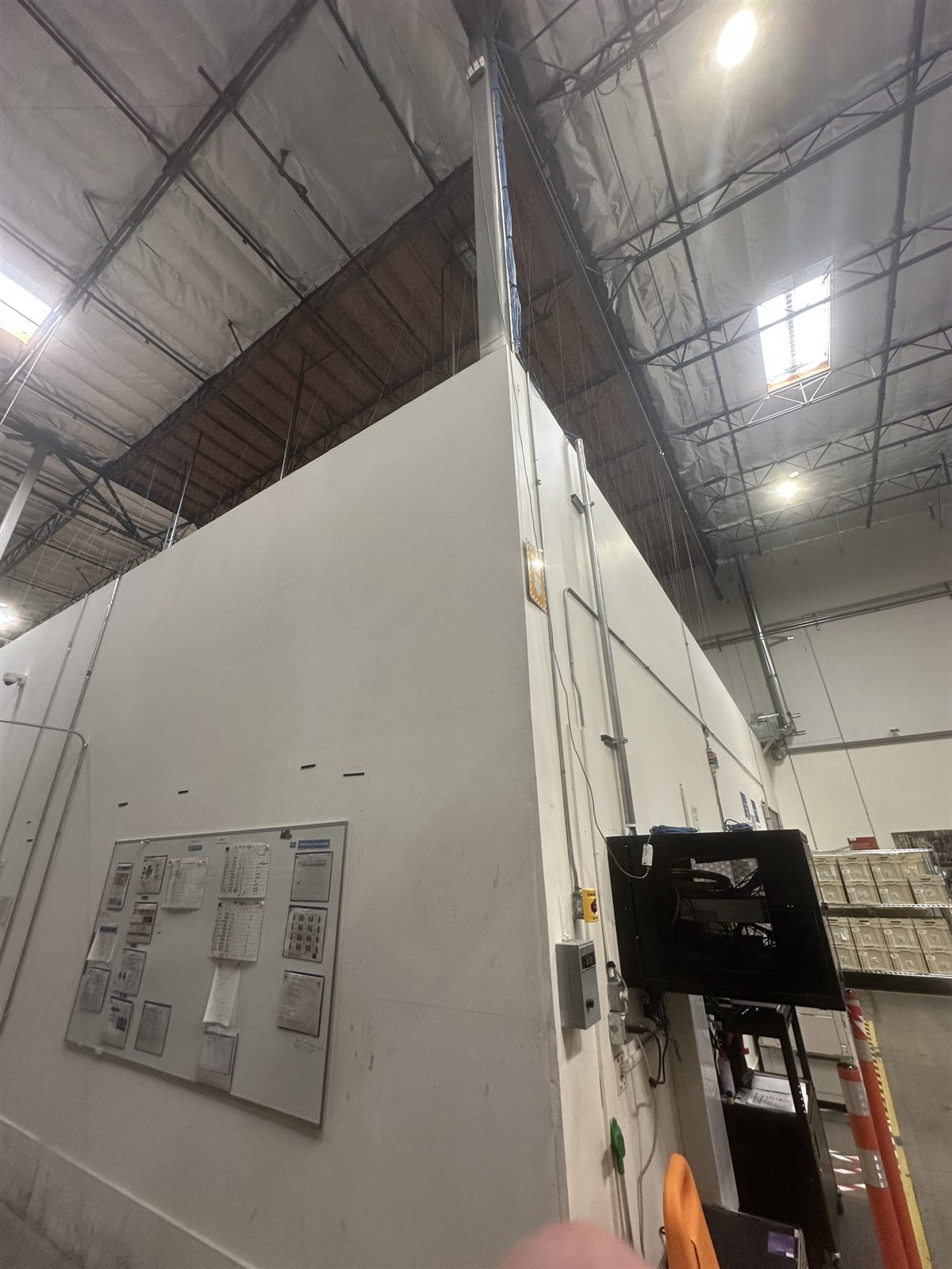 Plastic containment set up inside a warehouse before interior demolition