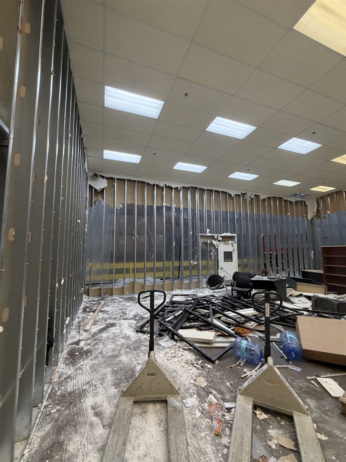 Warehouse interior wall coming down inside a cleared commercial space